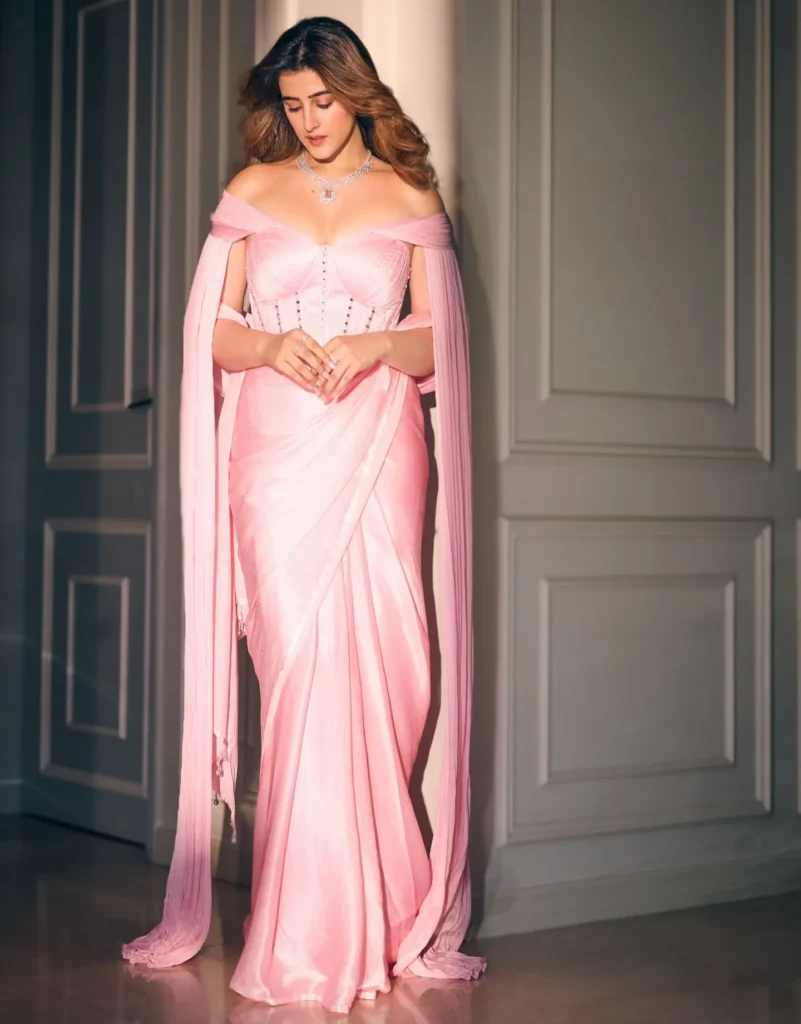 Nupur Sanon Dazzles in a Pink Manish Malhotra Saree: Latest Photoshoot HD Wallpapers 5 Nupur Sanon side profile pose in flowing cape sleeve saree