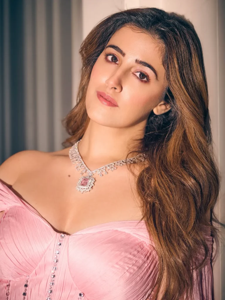 Nupur Sanon Dazzles in a Pink Manish Malhotra Saree: Latest Photoshoot HD Wallpapers 3 Nupur Sanon candid pose looking down in pastel pink outfit
