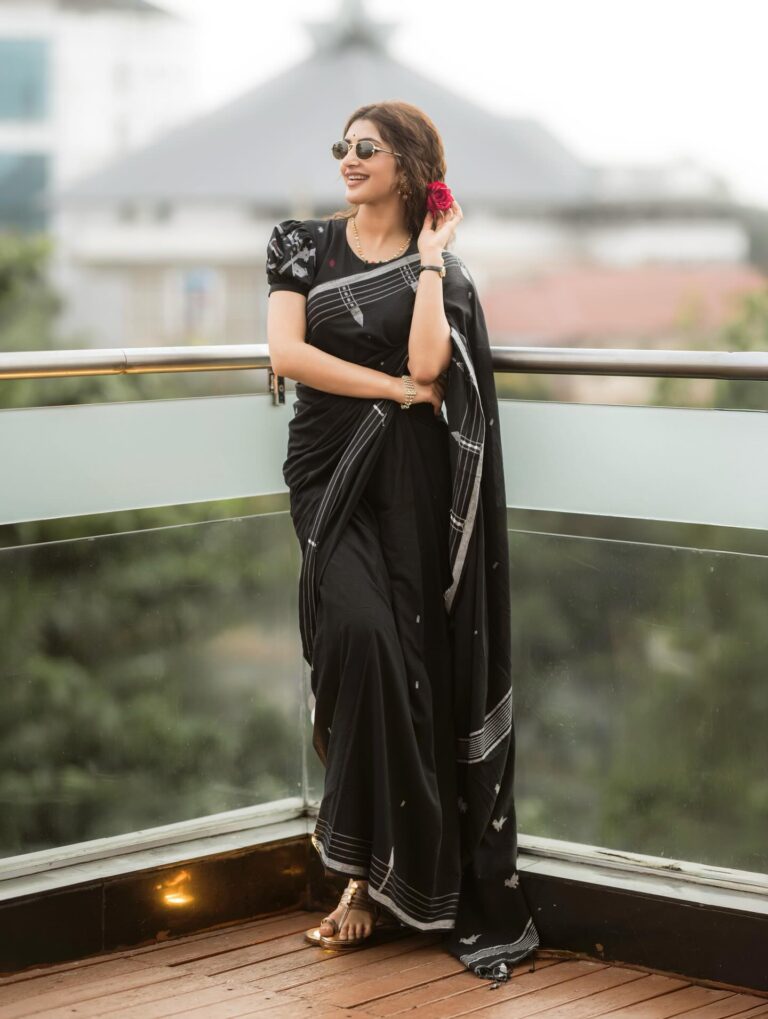 sreeleela black saree red rose sunglasses look.jpg