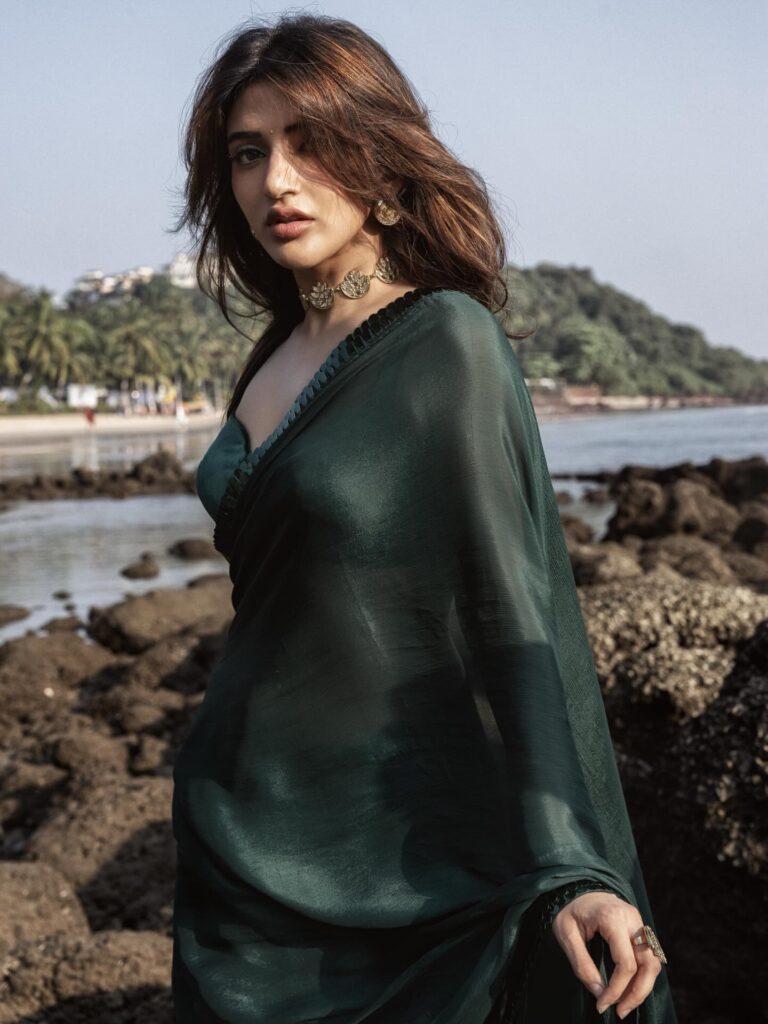 sreeleela emerald green saree gold choker beach photoshoot hd.jpg